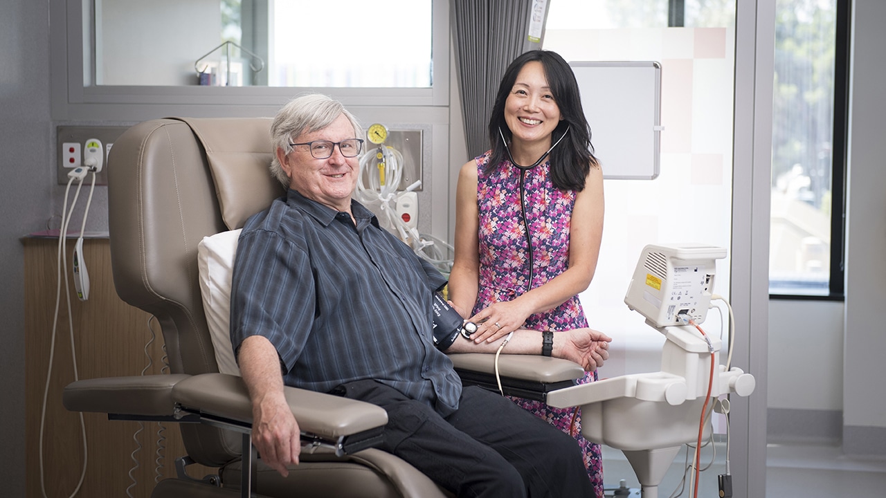 Associate Professor Jun Yang and clinical trial patient David