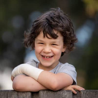 Luca Hall-Boggia a cancer survivor smiling at Hudson Institute. Picture Courtesy Jason Edwards /Herald Sun