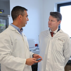 Associate Professor Jason Cain and Deputy Premier Ben Carroll in the Lab discussing childhood cancer collaboration