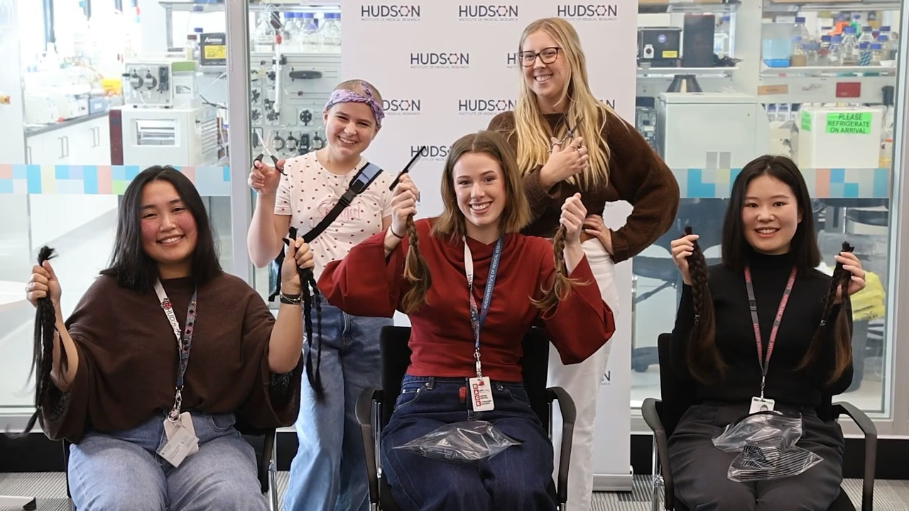  Front L-R: PhD students Lynda Truong, Ella Erickson and Jin Luo donated their long locks to “Wigs4Kids”. Back L-R: Novalie Morris, an amazing 12-year-old girl who is currently battling her 4th leukaemia relapse and Doing the cutting were Claire Josefsson, a leukaemia survivor-turned-researcher.
